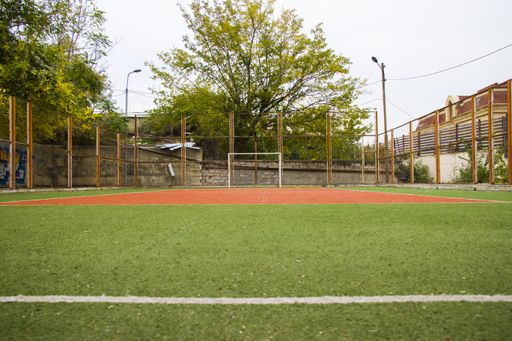 A scenic view at an empty soccer field on a sunny day