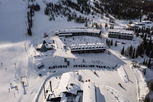 Aerial drone view overlooking resorts and restaurants, in Olos, Lapland, Finland