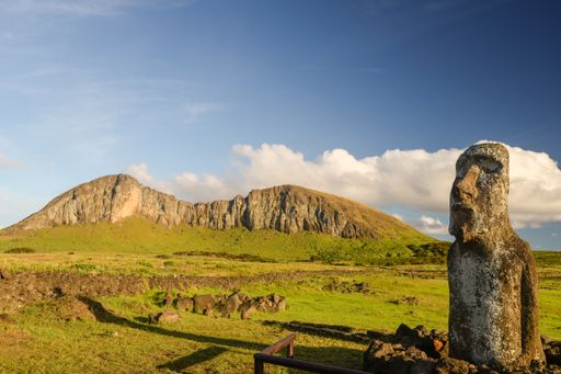 The traveling moai located at Tongariki's entrance with Rano Raraku volcano at the background