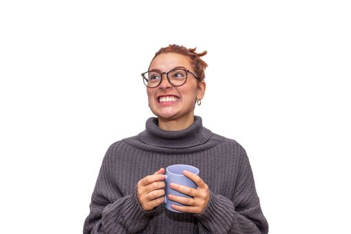 A young woman in eyeglasses holding a mug isolated on white background