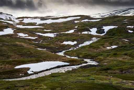 A beautiful view of the landscape with the hill covered in snow in Jordalen, Norway
