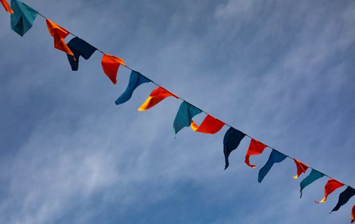 Red and blue celebration flags during carnival