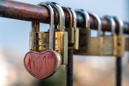 The promise of everlasting love marked with a padlock lock on the railing