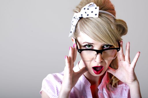 Beautiful blonde Pin-Up girl with a shocked face. Effect WOW.