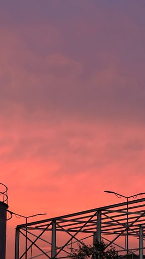 Spectacular sunset featuring vibrant tones of pink and purple hues radiating across the sky, creating a breathtaking sight
