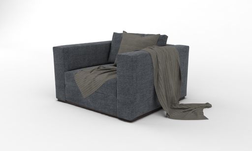 A closeup shot of a black armchair with a pillow and blanket on a white plain background