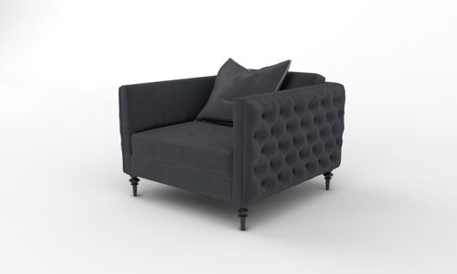 A closeup shot of a black armchair with a pillow on a white plain background