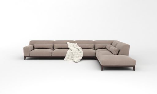 A 3D rendered modern corner sofa of light brown with a blanket on it on a white background