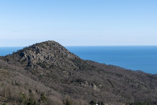 A natural view of a vast mountainous landscape under a clear sky background