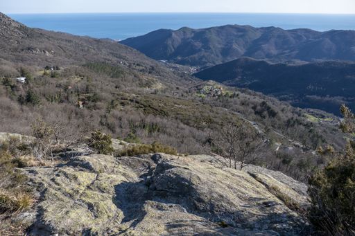 A natural view of a vast mountainous landscape under a clear sky background