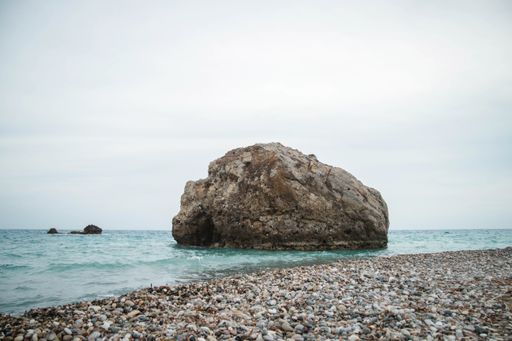 A wide angle shot of the Aphrodite's Rock in Cyprus during daytime