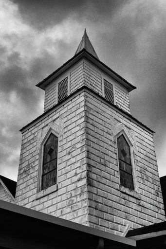 A low angle shot of an old church under a cloudy sky in Dade City, Florida