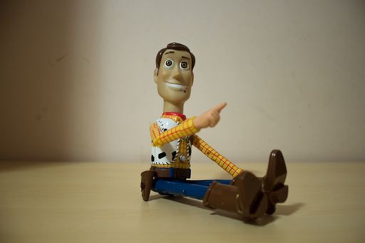 Avola, Sicily - March 21st 2021: Close up of Woody from the popular action movie Toy story, seated over a wooden table and smiling.