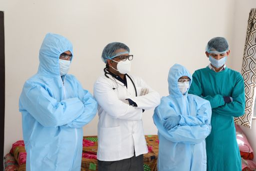 A closeup shot of four Indian doctors with medical uniforms and masks