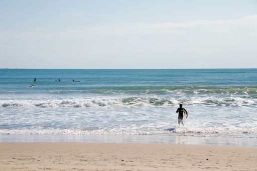 A surfer enjoying the waves in the Spanish Mediterranean