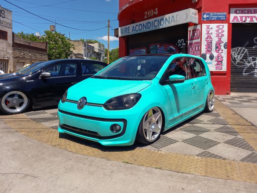 Volkswagen Up sedan 2000s. Expo Warnes 2022 classic car show. Sunny day.