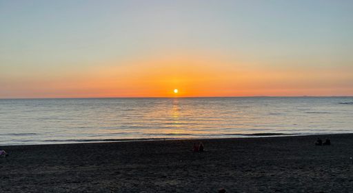 Sunset over the Irish Sea from seaside resort in West Wales.