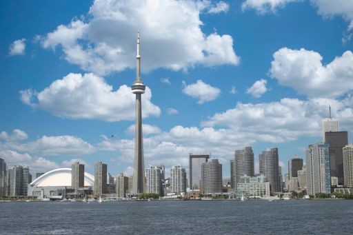 A stunning view of the bustling cityscape of Toronto, Canada during the day