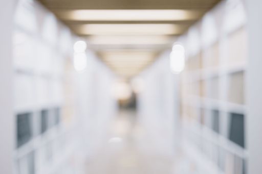 A blurry unfocused shot from store or office with bokeh background for head shot or business portrait