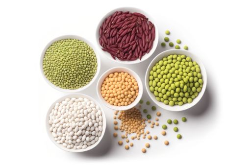 A white surface hosts four bowls filled with an assortment of beans and peas