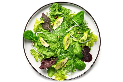 A white ceramic plate with a healthy green salad topped with crunchy nuts, ready to be enjoyed