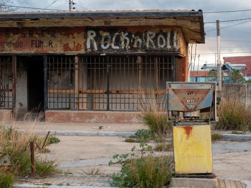 An old vandalized and dilapidated service station from the 60s