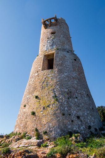 A vertical shot of the Torre del Gerro watchtower in Alicante, Spain