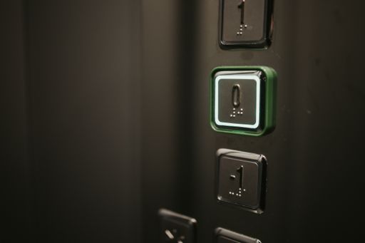 Theelevator buttons with floor numbers; background with copy space on the left