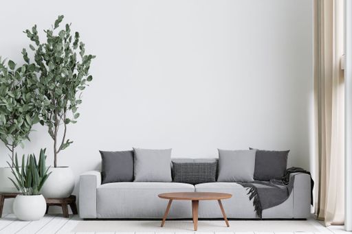 A 3D illustration of the minimalistic and spacious living room featured with pastel furniture