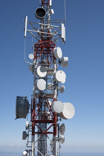 Detail of a large telecommunications antenna red and white color