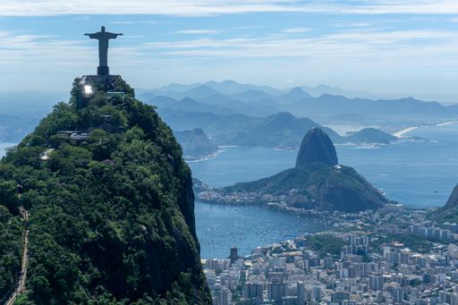 the iconic Rio de Janeiro skyline, with the world-famous Christ the Redeemer statue in the foreground