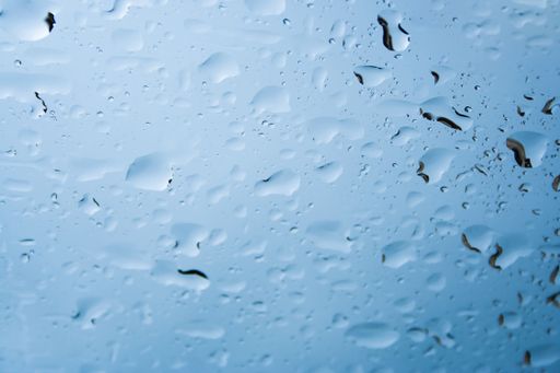 A closeup of water drops on window glass