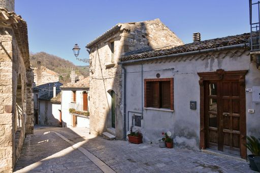 A narrow street among the old houses of Civitacampomarano, a medieval town in the province.