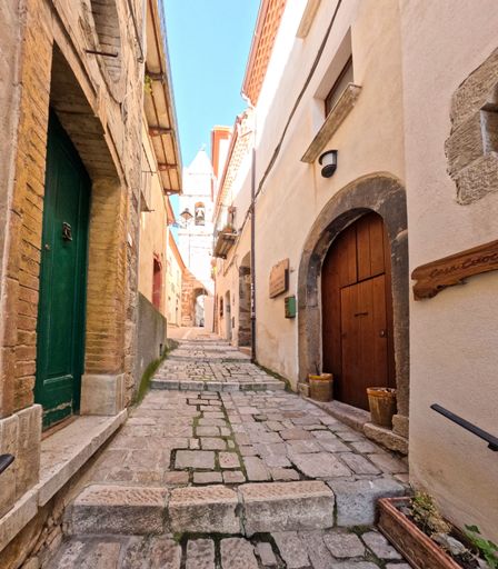 A narrow street among the old houses of Civitacampomarano, a medieval town in the province.