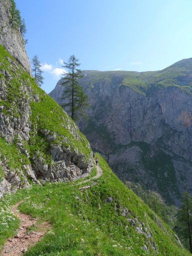 hikers on a mountain trail at Berchtesgaden national park near Koenigssee in summer, bavarian alps, Germany