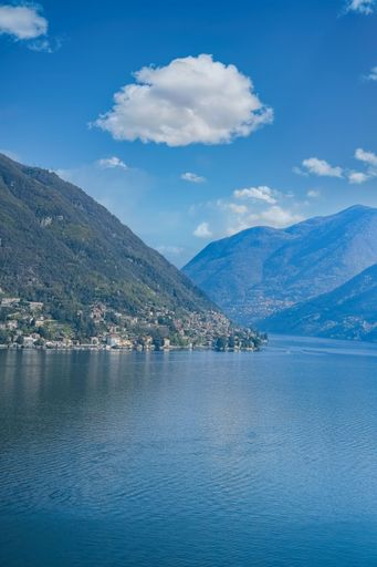 Como city in Italy, view of the city from the lake, with mountains in background