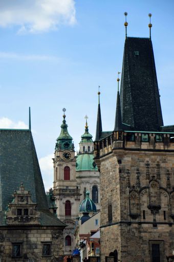 A majestic clock tower in the city of Prague, Czech Republic, surrounded by beautiful scenery