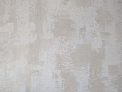 This is a close-up image of a grey concrete wall or floor with a textured pattern