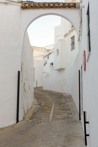 A narrow road or path in an old village Vejer de la Frontera, Grazalema, Spain