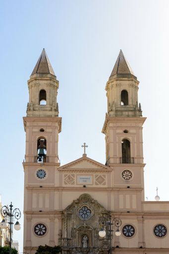A low-angle shot of a religious Cathedral in Cadiz, Andalusia, Spain against the clear blue sky
