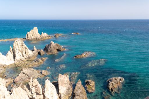 The Sirenas Reef in the Cabo de Gata Natural Park under the sunlight and a blue sky in Spain