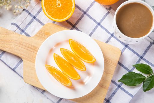 An overhead shot of orange slices on a kitchen table