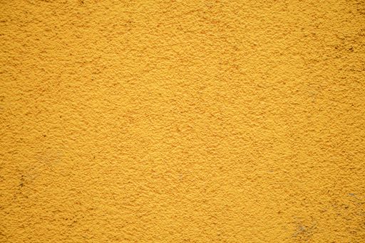 A yellow mineral plaster texture background
