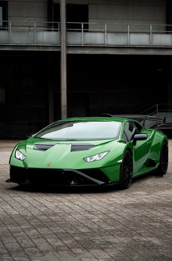 A vertical shot of a beautiful sleek luxurious Lamborghini Huracan Sto parked outdoors