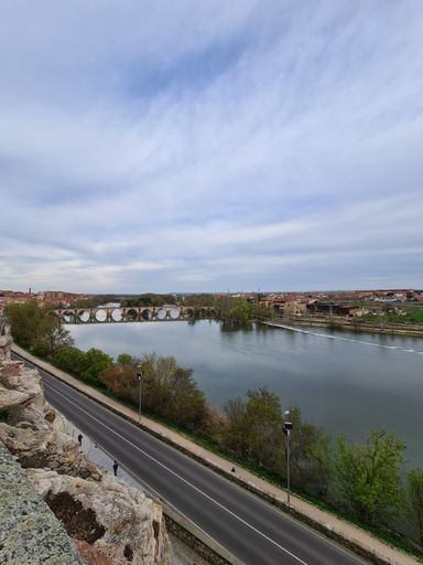 The Douro river under the cloudy sky in Zamora, Spain- view from Mirador del Troncoso