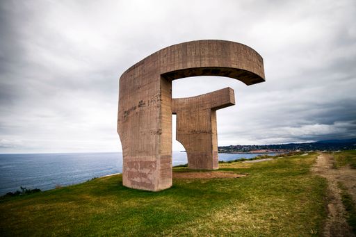 Monument "Elogio del Horizonte" situated in Cerro de Santa Catalina Cimadevilla Gijon, with a cloudy sky backdrop