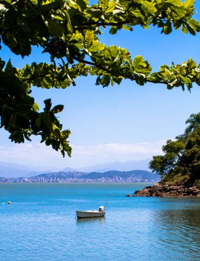 A vertical shot of a fishing boat in North Bay in Florianopolis, Brazil