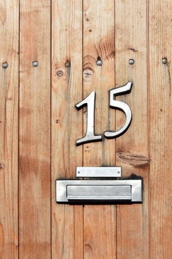 A vertical shot of a hoise door with the number 15