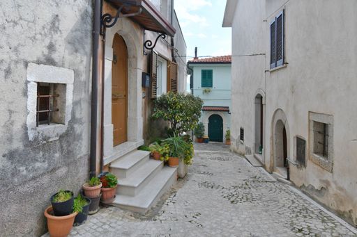A narrow street among the old houses of San Lupo, a small town of Benevento province.