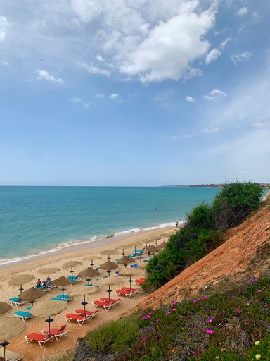 A serene, pristine beach stretches along the horizon in Portugal